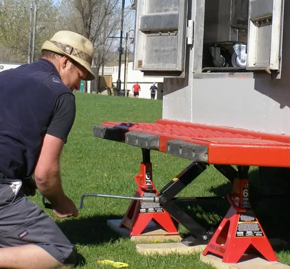 Joe levelling the truck for the mobile bike shop setup