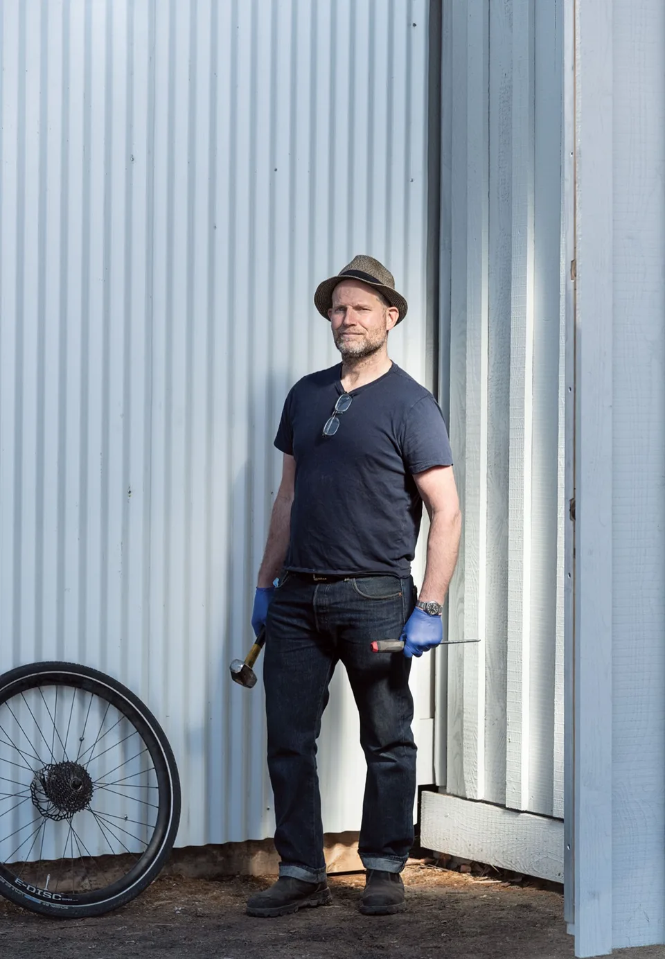 Joe, the man himself, leaning against the container shop